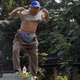 A petitioner lifts his shirt to show his injuries as he climbs a pillar to protests his own grievances near the Jinan Intermediate People's Court in Jinan in eastern China's Shandong province on Thursday Aug. 22, 2013. Ousted populist Chinese politician Bo Xilai went on trial Thursday on charges of bribery, embezzlement and abuse of power, marking the ruling Communist Party's attempts to draw a line under one of its most lurid political scandals in decades. Individual protestors have turned up at the court hoping to take advantage of media attention around Bo’s trial to air their own grievances about China’s legal system. (AP Photo/Ng Han Guan